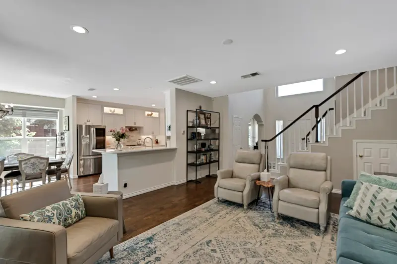 Open kitchen/living, island centered, clear room flow, staged — Dallas/Fort Worth real estate photography