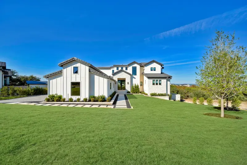 Modern white-farmhouse estate elevation — Austin real estate photography