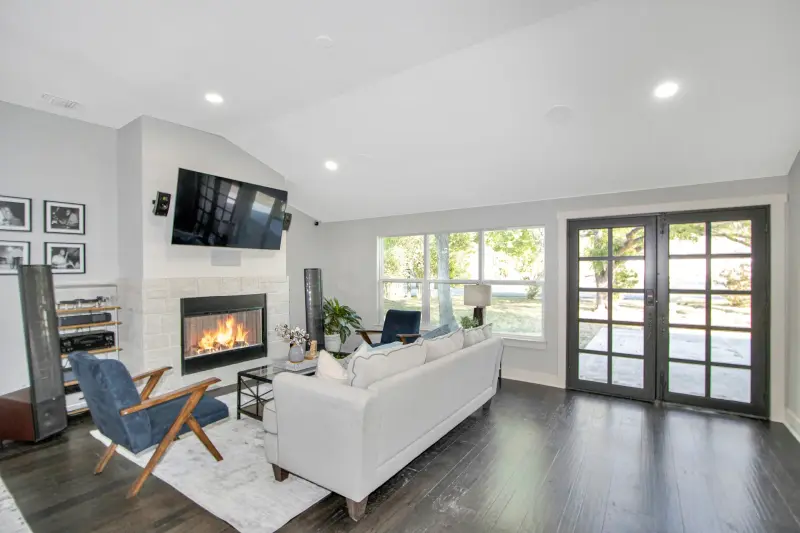 Strong hero angle, whole room, fireplace focal point — San Antonio real estate photography